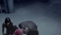 a man kneeling down next to a woman in the snow