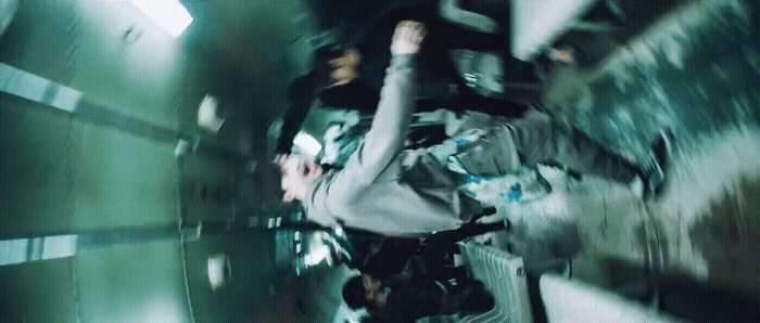 a man riding a skateboard through a tunnel
