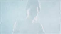 a blurry image of a person standing in the fog