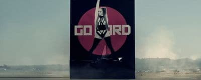 a large billboard with a woman holding a flag