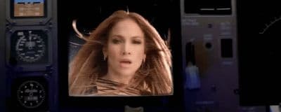 a woman's face is projected on a screen