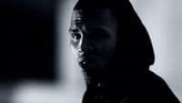 a man in a hoodie making a face