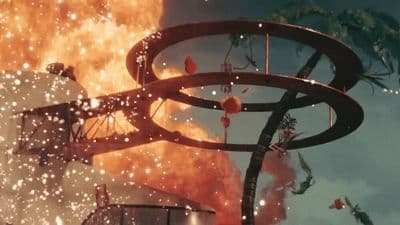 a large fire is raging out of a building