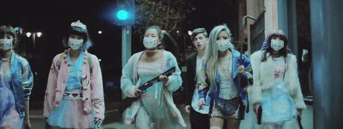 a group of people in costumes walking down a street