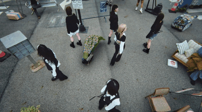 a group of people dressed in black and white