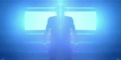 a person standing in front of a tv in a room
