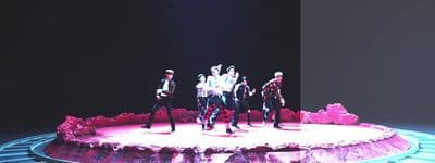 a group of people standing on top of a stage