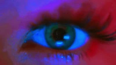 a close up of a person's blue eye
