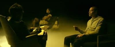 a couple of people that are sitting in a chair