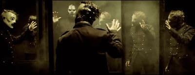 a group of people standing in front of a mirror