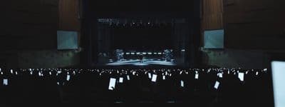 a view of a stage from the back of the room