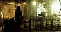a person standing in a dimly lit room