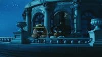 a couple of stuffed animals sitting on top of a building