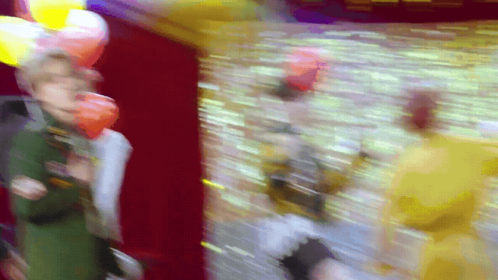 a blurry photo of a person holding balloons