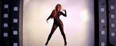a picture of a woman in a body suit