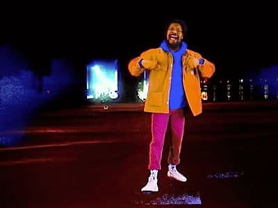 a man in a yellow jacket and pink pants