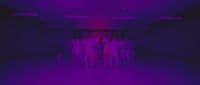 a group of people standing in a dark room