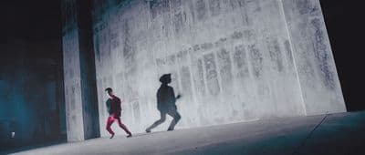 a couple of people that are walking down a street