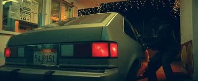 a car is parked in front of a building