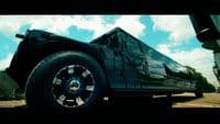 a black truck parked on the side of a road