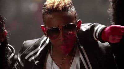a man wearing sunglasses and a black jacket