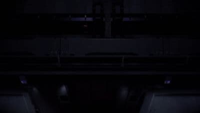 a dark room with two doors and a window