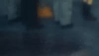 a blurry photo of a person walking down a street