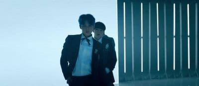 a couple of men standing next to each other