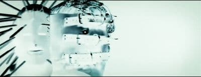 a woman's face is reflected in a mirror