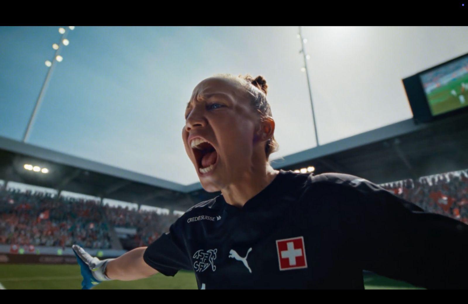 a woman with her mouth open in a stadium