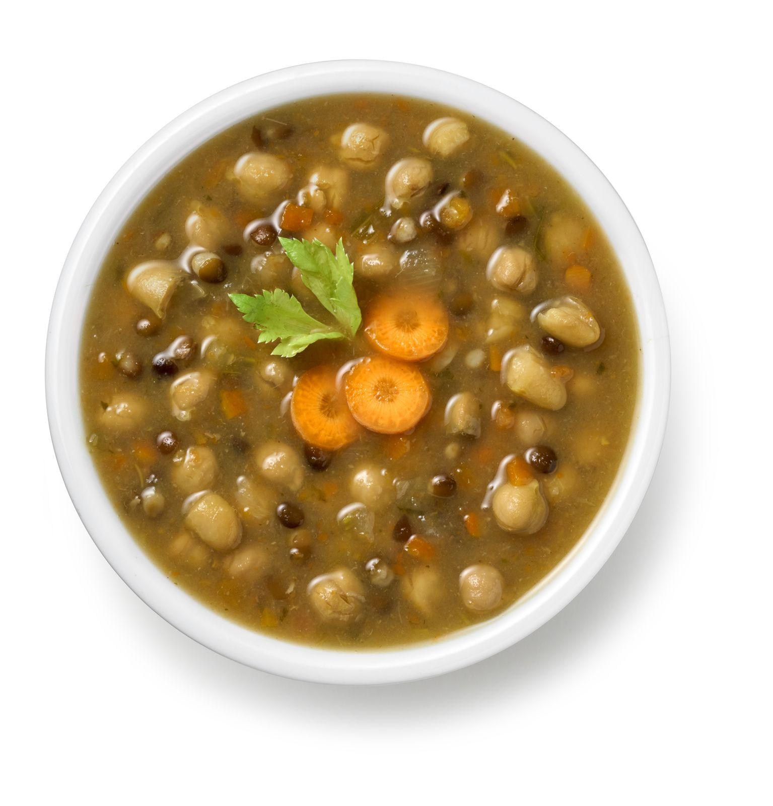 a white bowl filled with beans and carrots