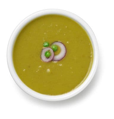 a white bowl filled with soup and vegetables