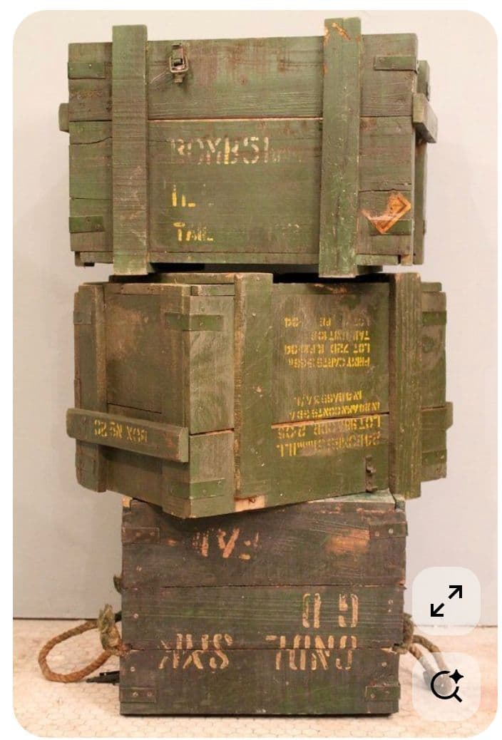 a stack of wooden crates sitting on top of each other