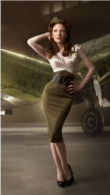 a woman standing in front of an airplane