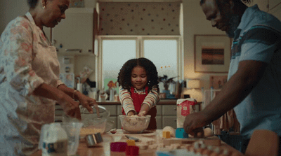 a group of people in a kitchen preparing food