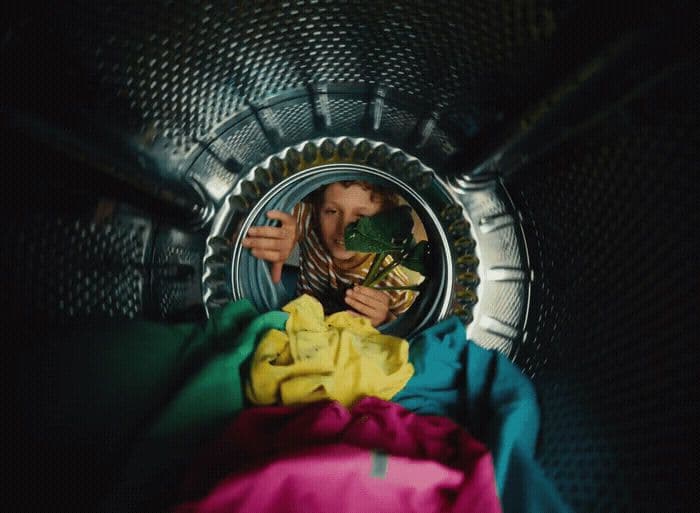 a woman looking at her reflection in a mirror