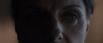 a close up of a person's face with a blurry background