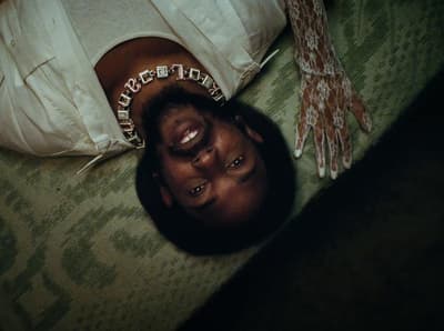 a person laying on the floor with their hands on the floor