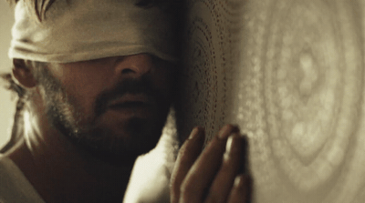 a man with a bandage on his head is holding a plate