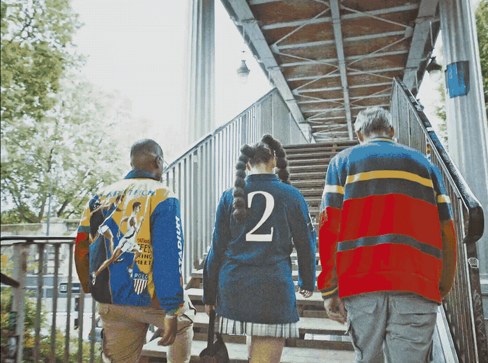 a group of people walking up a flight of stairs