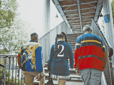 a group of people walking up a flight of stairs