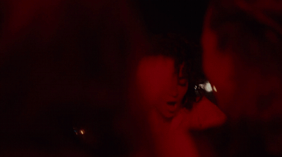 a blurry image of a woman talking on a cell phone