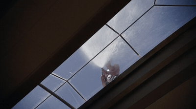 a person standing on a ledge with their feet up