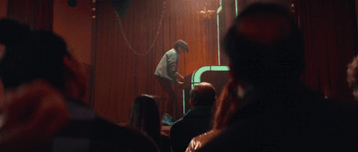 a man standing in front of a mirror in a room