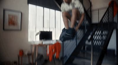 a man climbing up a flight of stairs