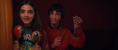 a couple of people that are holding some balls