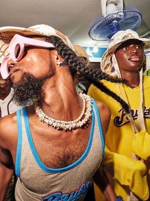 a group of men wearing hats and sunglasses
