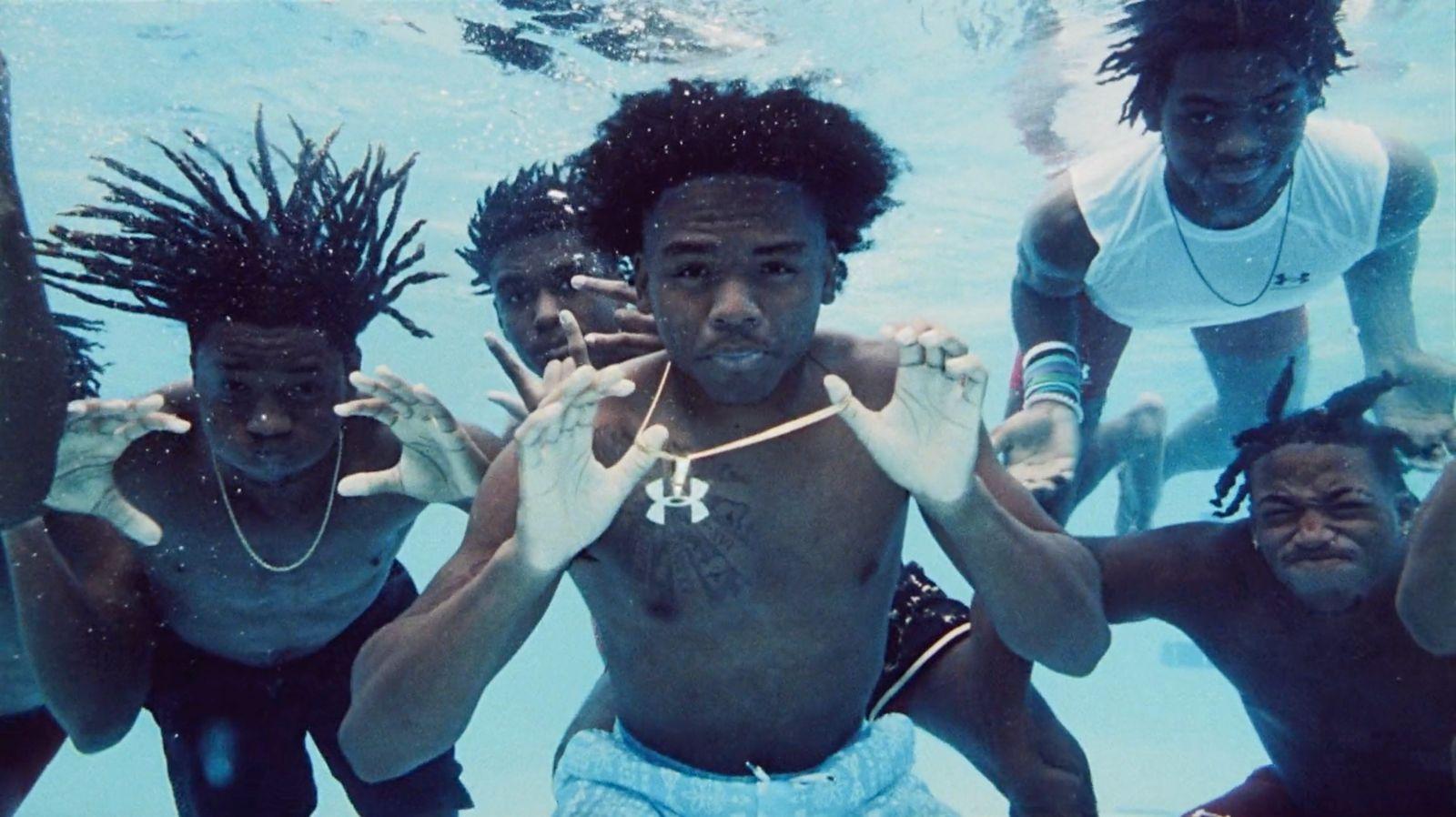 a group of people standing under water in a pool