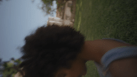 a blurry photo of a person in a yard