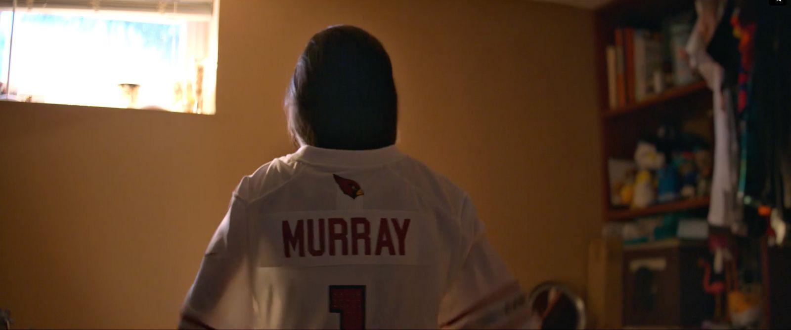 the back of a woman's shirt that reads murray